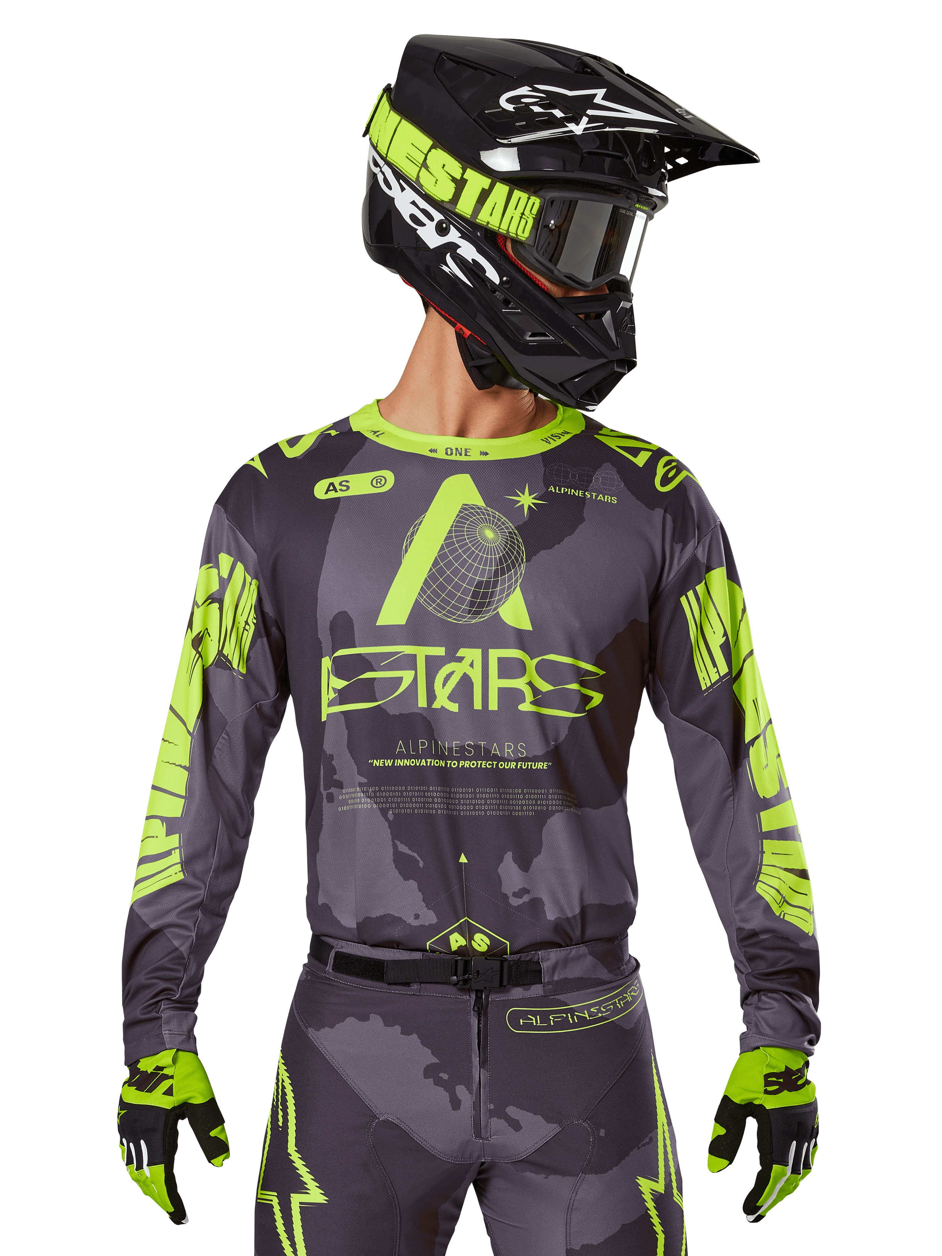 Alpinestars 2025 Racer Hollow Jersey, Motocross Racing Jersey, Dark Camo and Neon Yellow, worn with matching pants, black and yellow helmet with goggles, and black gloves, featuring Alpinestars branding and camouflage design