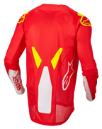 Alpinestars Techstar Factory trøje, motocross trøje, rød fluo, hvid og gul fluo, set bagfra med mesh-ventilationspaneler og forlænget rygprofil, hvidt ASTARS-branding på ærmerne og gule fluo grafiske detaljer på skuldrene.