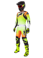 Alpinestars 2025 Fluid Wurx Gear Set, Motocross Racing Outfit, Neon Yellow and Orange gradient, complete kit with jersey and pants, black helmet with orange goggles, neon yellow boots and gloves, athletic design for off-road performance