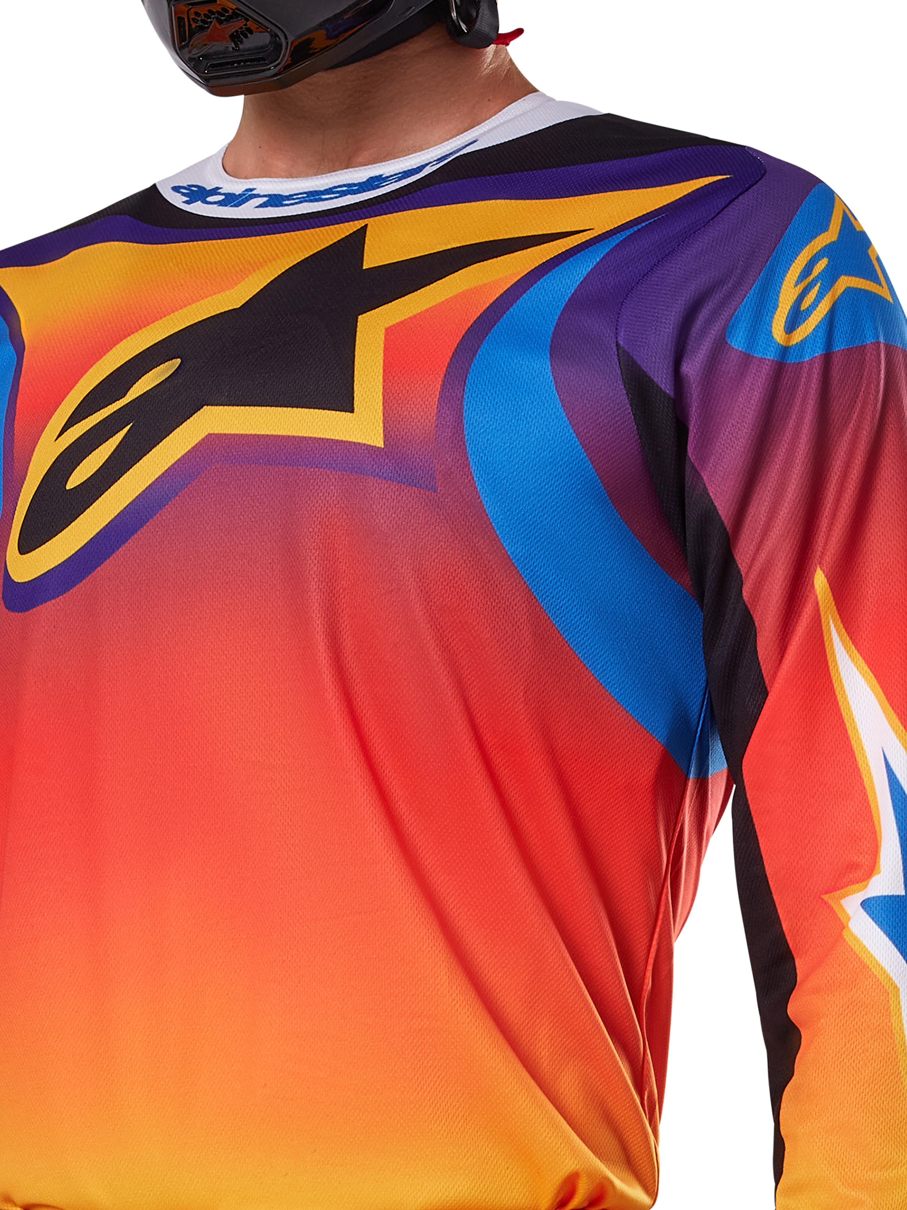 Alpinestars 2025 Fluid Wurx trøje, flerfarvet hvidt og orange design, langærmet motocross-trøje, afslappet atletisk pasform, fugttransporterende poly-materiale til off-road præstation