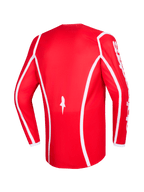 Alpinestars 2026 Fluid Apex trøje, rød og hvid, set bagfra, langærmet motocross-trøje med hvide buede accentlinjer, stjernelogo forneden og hvid Alpinestars-tekst på ærmerne, designet til terrænkørsel
