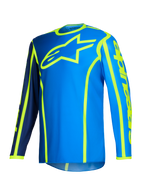 Alpinestars 2026 Fluid Apex trøje, motocross-trøje, blå og gul fluo, stort fluorescerende gult stjernelogo på brystet, lange ærmer med mørkeblå og lyseblå sektioner, lodret branding på armen, sportsligt off-road udstyr