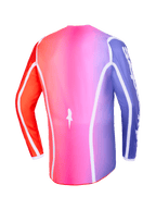 Alpinestars 2026 Fluid Apex Jersey, set bagfra, flerfarvet pink, lilla og orange gradient, med hvide buede kanter og et forlænget bagstykke, professionelt motocross- og off-road-tøj