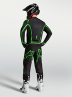 Alpinestars Fluid Apex V2 bukser, motocrossbukser til mænd, sort og grøn, ergonomisk pasform i komplet gearsæt set bagfra.