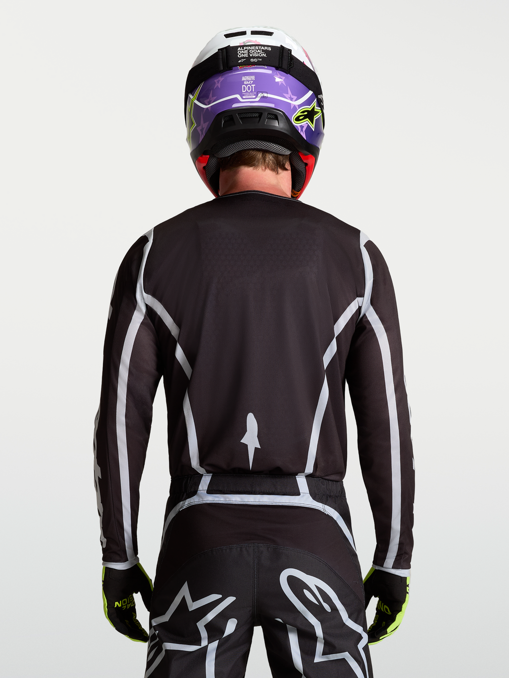 Alpinestars Fluid Apex V2 trøje, herre-motocrosstrøje i sort og sølv, set bagfra med ergonomisk atletisk pasform.
