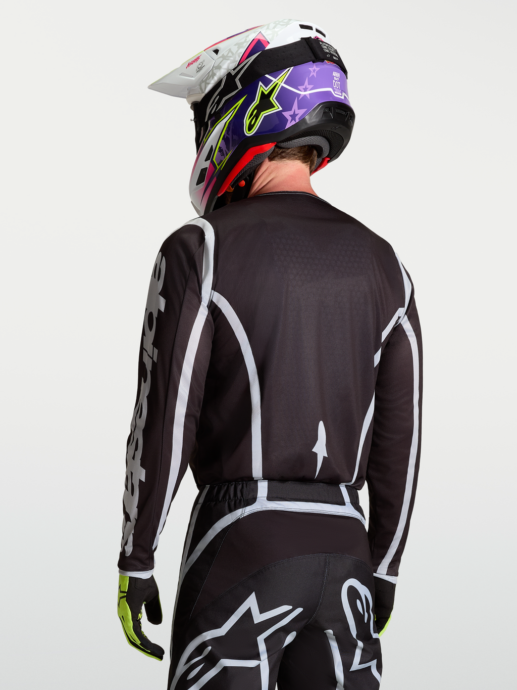 Alpinestars Fluid Apex V2 trøje, motocross racingtrøje til herrer, sort og sølv, fugttransporterende polyfabrik, set bagfra på model