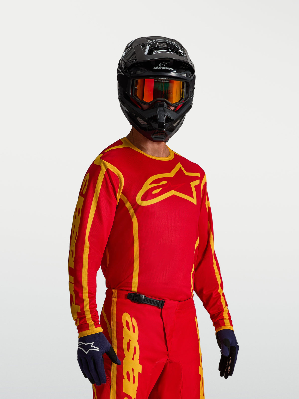 Alpinestars Fluid Apex V2 Jersey, relaxed fit Men's Motocross Jersey in Fire Red and Gold with breathable polyfabric.