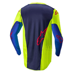 Alpinestars 2024 Racer Hoen jersey, motocross-trøje, gul fluo og Blue Night Navy, set bagfra viser mørkeblåt midterpanel med rødt logo, klare gule sidestykker, lange ærmer og åndbart mesh-stof designet til off-road præstation.
