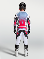 Alpinestars Fluid Drag trøje, herre-motocrosstrøje i sort og rød fluo, set bagfra på en kører til motocross racing.