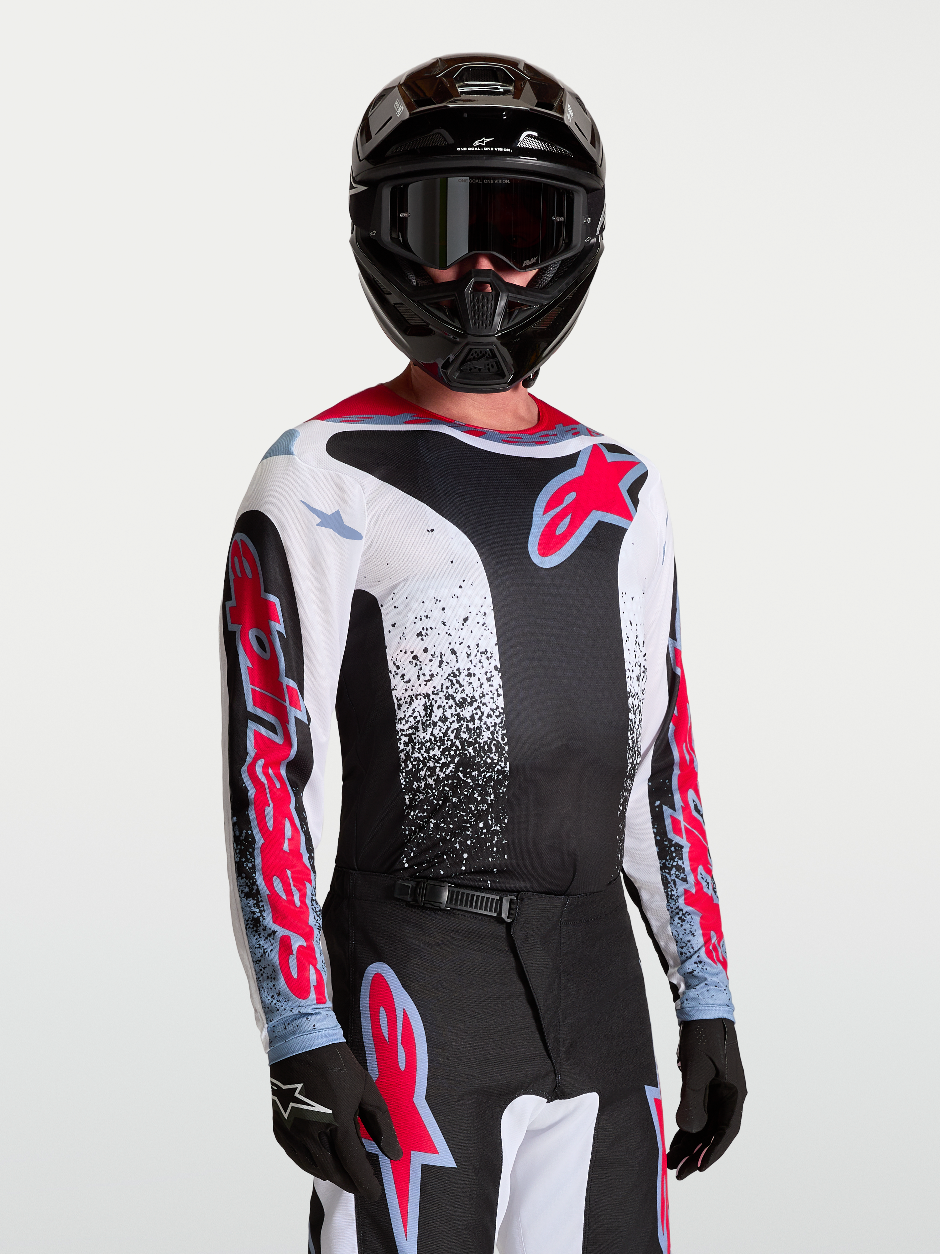 Alpinestars Fluid Drag trøje, herre-motocrosstrøje i sort og hvid med røde detaljer, let og åndbart tekstil.