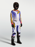 Alpinestars Fluid Drag udstyrssæt og bukser, herre-motocrossbeklædning i lilla, blå og guld, vist på model.