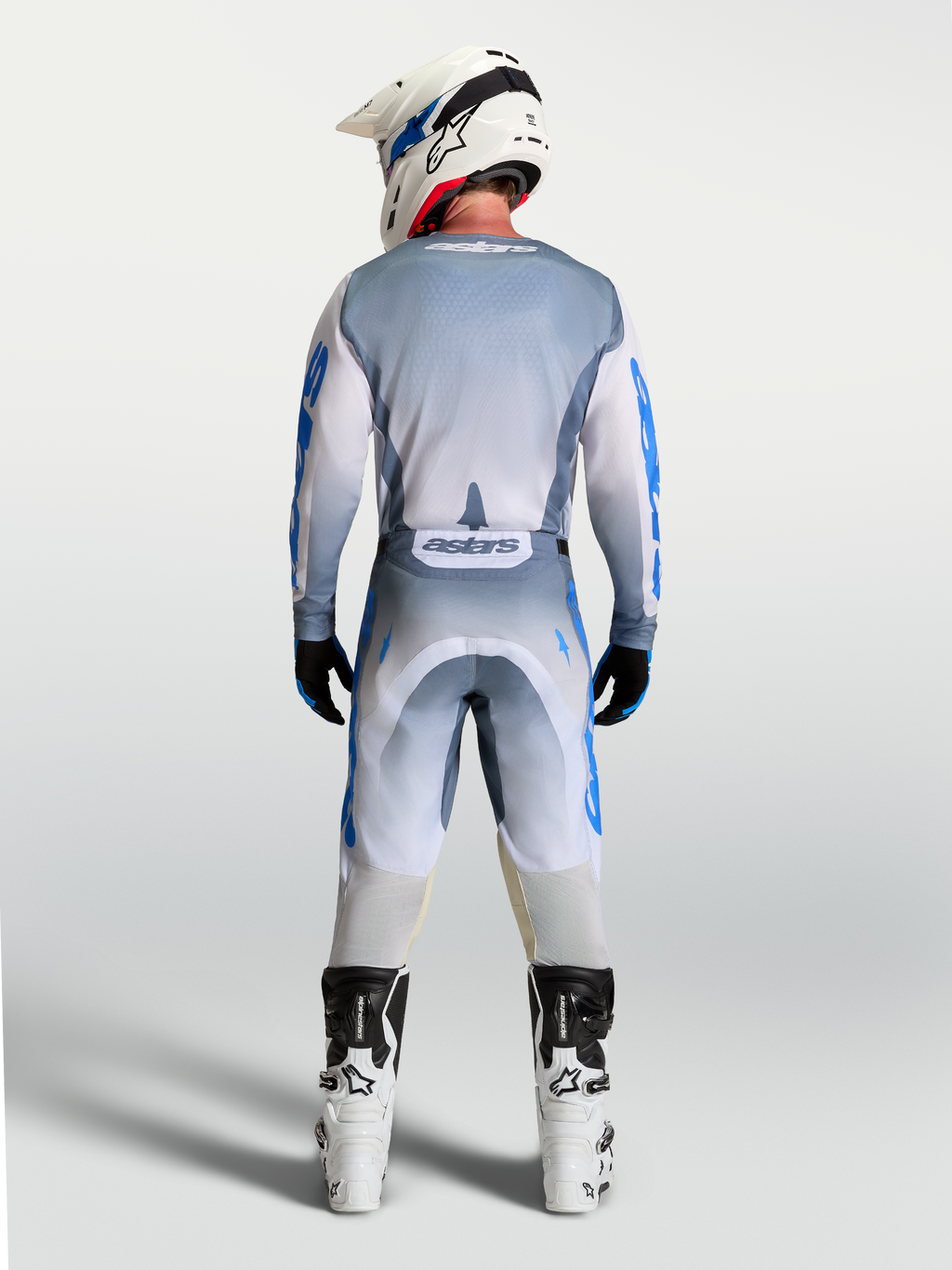 Alpinestars Racer Amber trøje, herre-motocrosstøj i grå og blå, vist i fuld profil bagfra på en model.