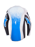 Alpinestars Fluid Drag trøje, blå og grå motocrosstrøje til herrer, set bagfra med splattergrafik og hvide stjernelogoer, let og åndbart materiale til off-road kørsel.