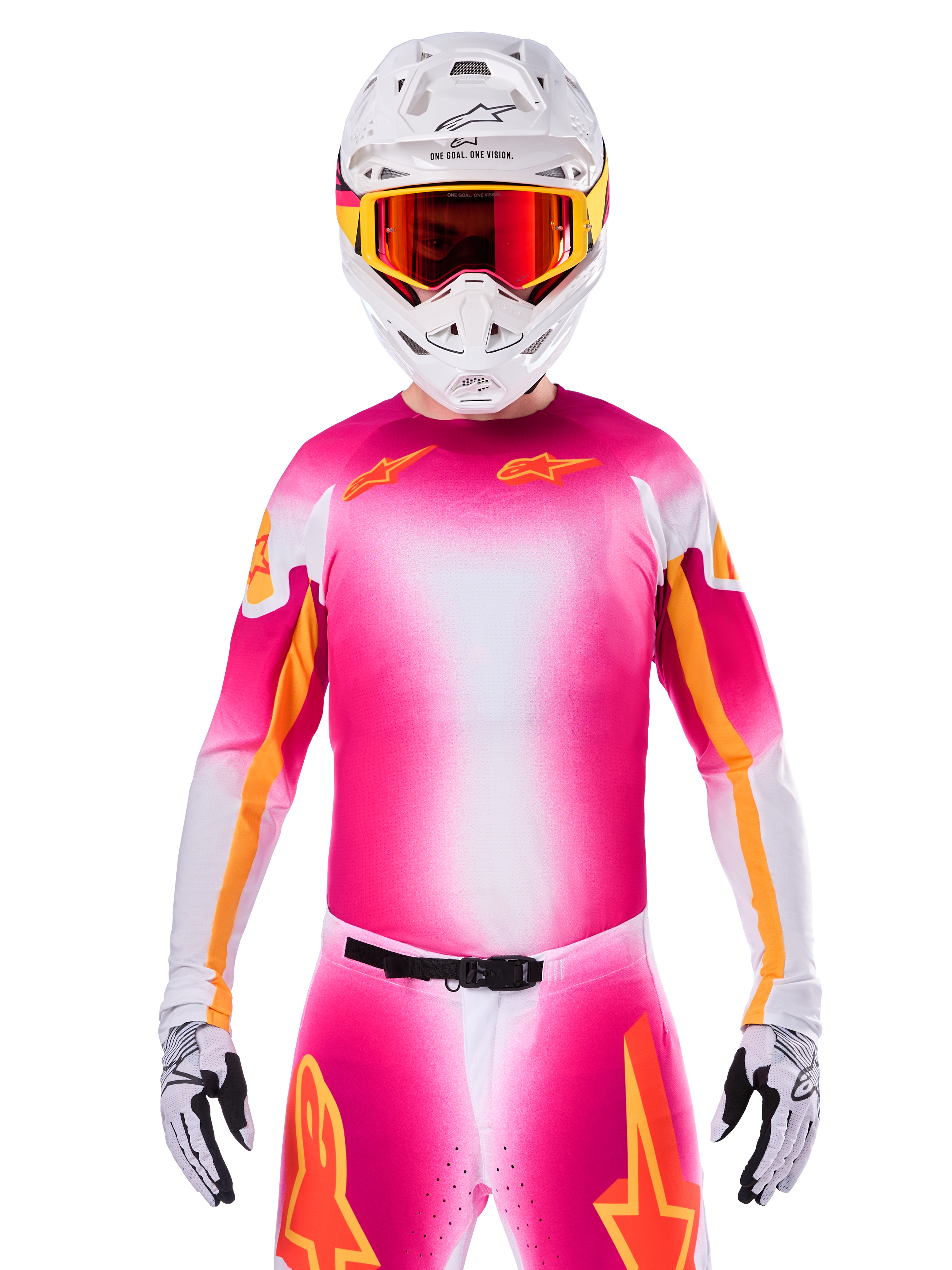 Alpinestars Limited Edition Supertech AFD MIG Jersey, lyserød fluo hvid motocross-trøje med en livlig farveovergang og orange stjernelogoer, her vist som et komplet racersæt med matchende bukser, hvid hjelm og røde briller, professionelt udstyr til terrænkørsel