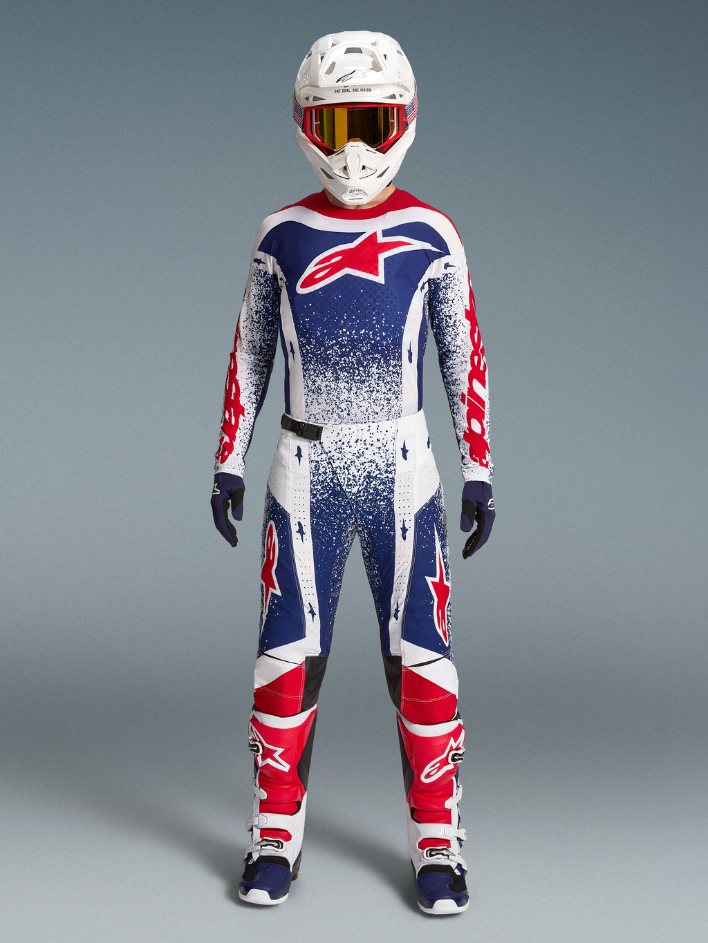 Alpinestars Begrænset Udgave Techstar Unity Komplet-Sæt, herre-motocrossracerdragt i hvid, blå og rød grafik.