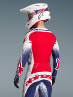 Alpinestars Begrænset Udgave Techstar Unity Komplet-Sæt, rød, hvid og blå motocross-racerdragt med stjernegrafik, set bagfra
