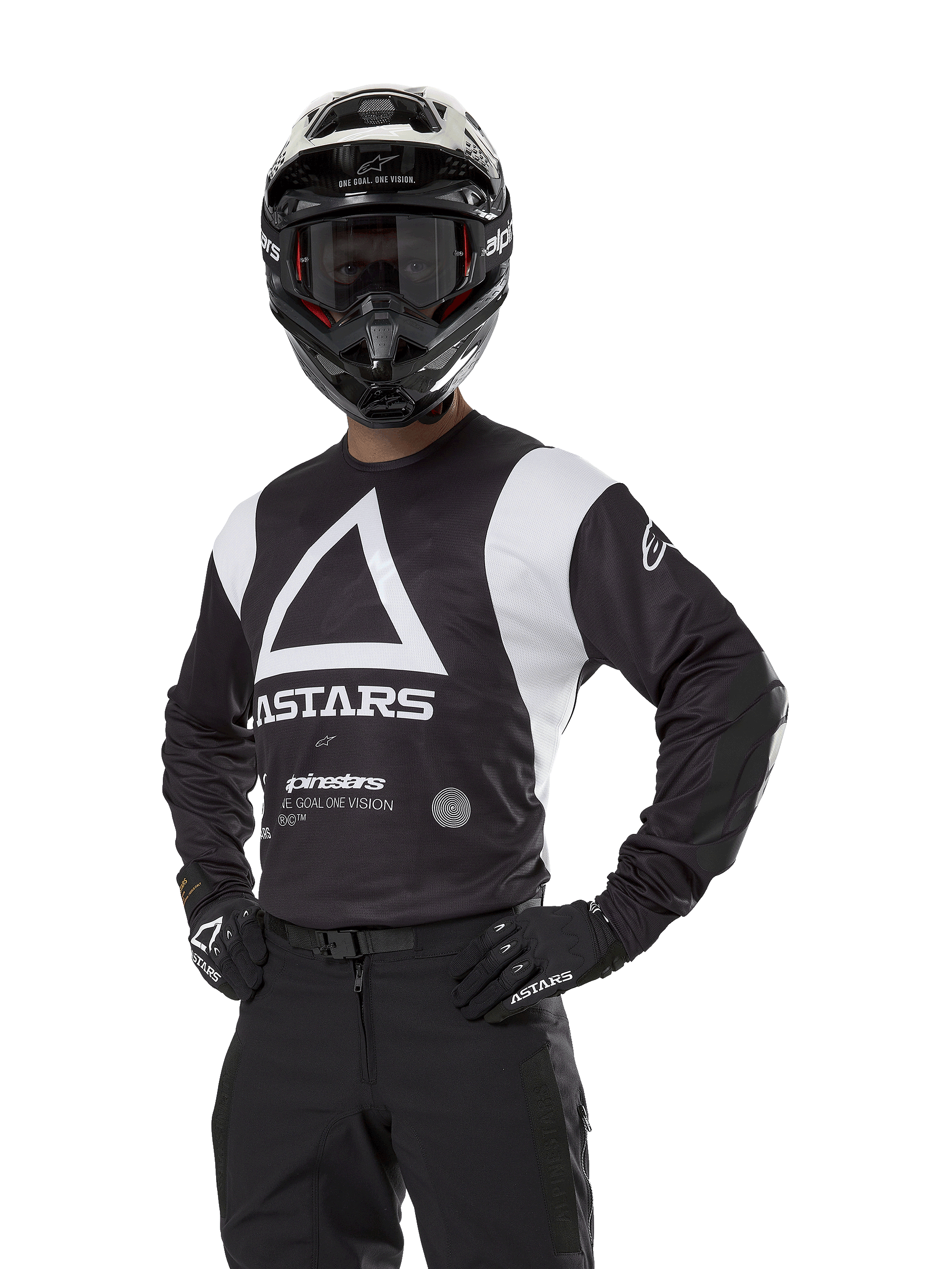 Alpinestars Techdura Jersey, Motocross Jersey, Black and White, worn with matching helmet and gloves, hands on hips pose against white background, featuring large triangle A logo and ASTARS branding
