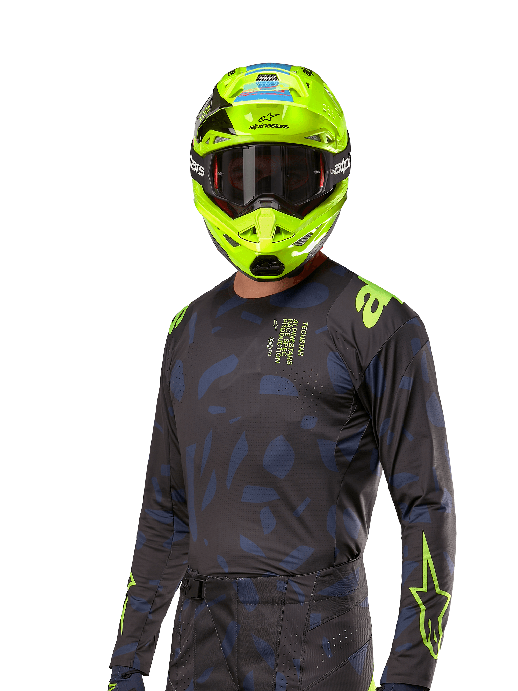 Alpinestars 2024 Techstar Rantera Jersey, motocross racingtrøje, sort og navy med abstrakte mønstre og neongule accenter, båret med matchende neongul hjelm, performance fit-design til off-road kørsel