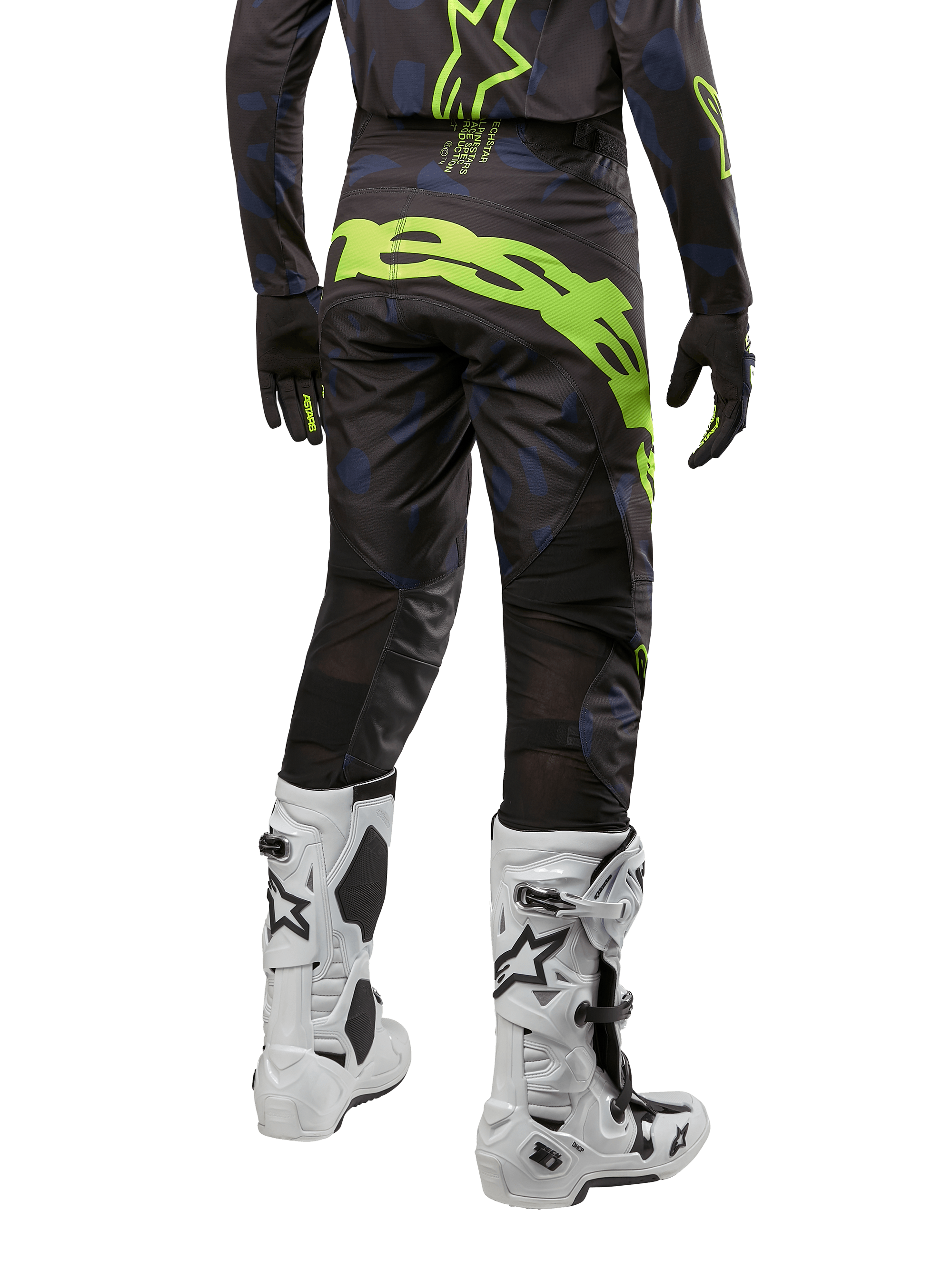 Alpinestars 2024 Techstar Rantera bukser, motocrossbukser, sort, navy og gul fluo, set bagfra, med markant neongul grafik og ventilationspaneler i mesh, båret med matchende trøje og hvide støvler, slidstærkt udstyr til motocross og off-road kørsel