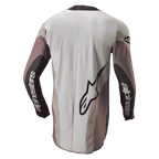 Alpinestars 2024 Techstar Pneuma trøje, motocross-trøje, set bagfra i Dark Sand Iron Dust Gray, med et stort Alpinestars-logo og branding på ærmerne, atletisk pasform med farveopdelte paneler og en forlænget bagdel for dækning.