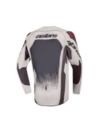 Alpinestars 2027 Ungdom Supertech Swan trøje, grå og mørkegrå motocrosstrøje med ventileret mesh, set bagfra.