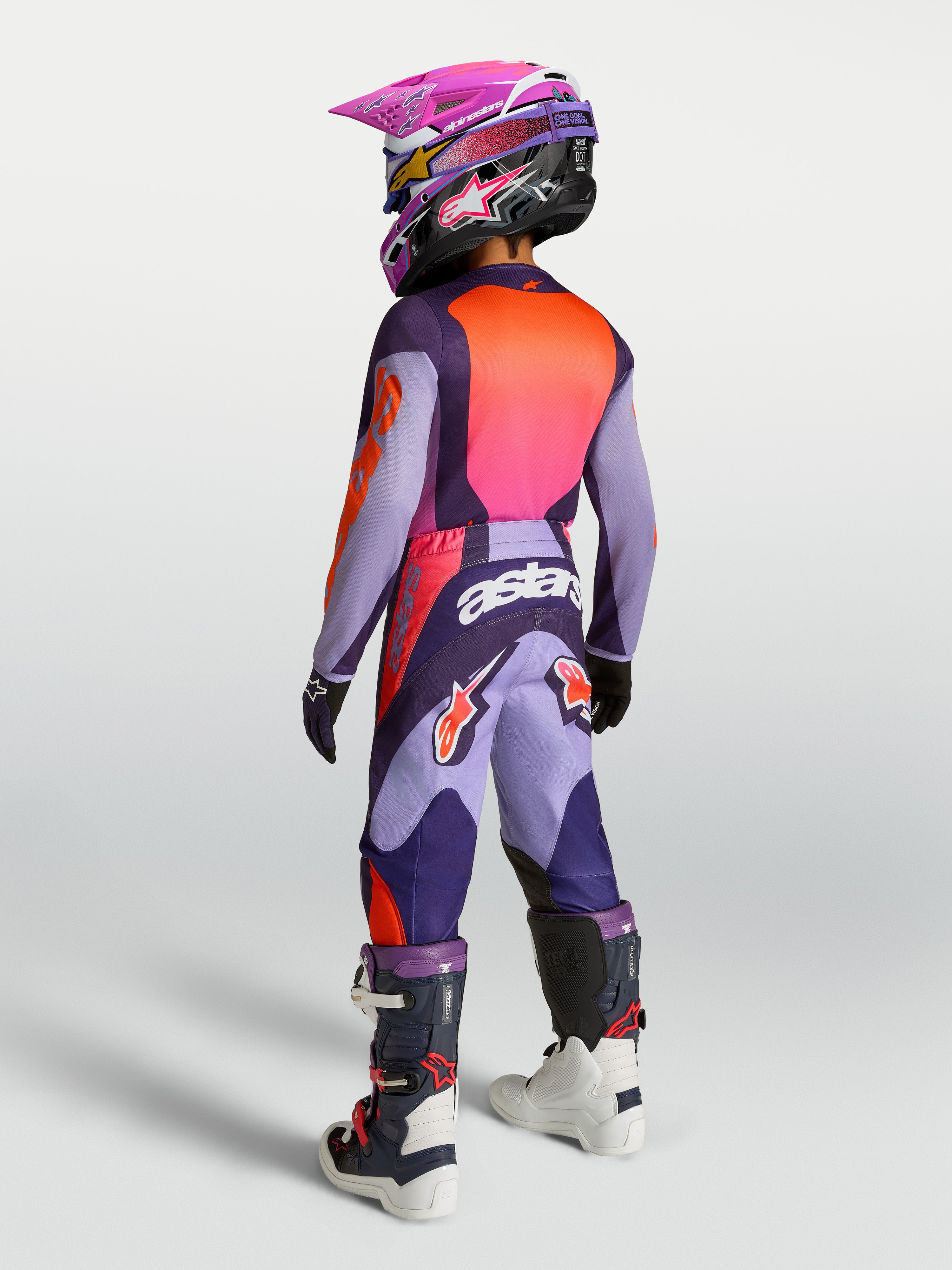 Alpinestars 2027 Youth Fluid Hunt Jersey and Gear Set in purple and pink fluo, rear view of youth motocross riding kit.