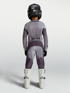Alpinestars 2027 Youth Fluid Amber Jersey and Gear Set, gray and purple motocross racing gear, rear view on youth rider.