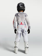 Alpinestars 2027 Youth Fluid Lone Jersey and Gear Set, gray camo and white motocross gear with fire red accents, back view.