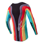 Alpinestars Stella 2024 Techstar trøje til kvinder, motocross trøje, sort multicolor, set bagfra med et levende bølget flerfarvet mønster i rød, gul og turkis, hvidt Astar-logo nederst på ryggen, Alpinestars-branding på ærmerne