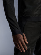 Alpinestars Troop-Air Jacket, Black, close-up showing technical mesh construction, branded patch with technical text, and sleeve with integrated thumb-hole loop, urban summer motorcycle jacket with high-airflow design