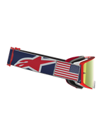 Alpinestars Supertech Fiftyfold Limited Edition motocross-goggles, blå og rød med rød spejllinse og USA-flagpatch.