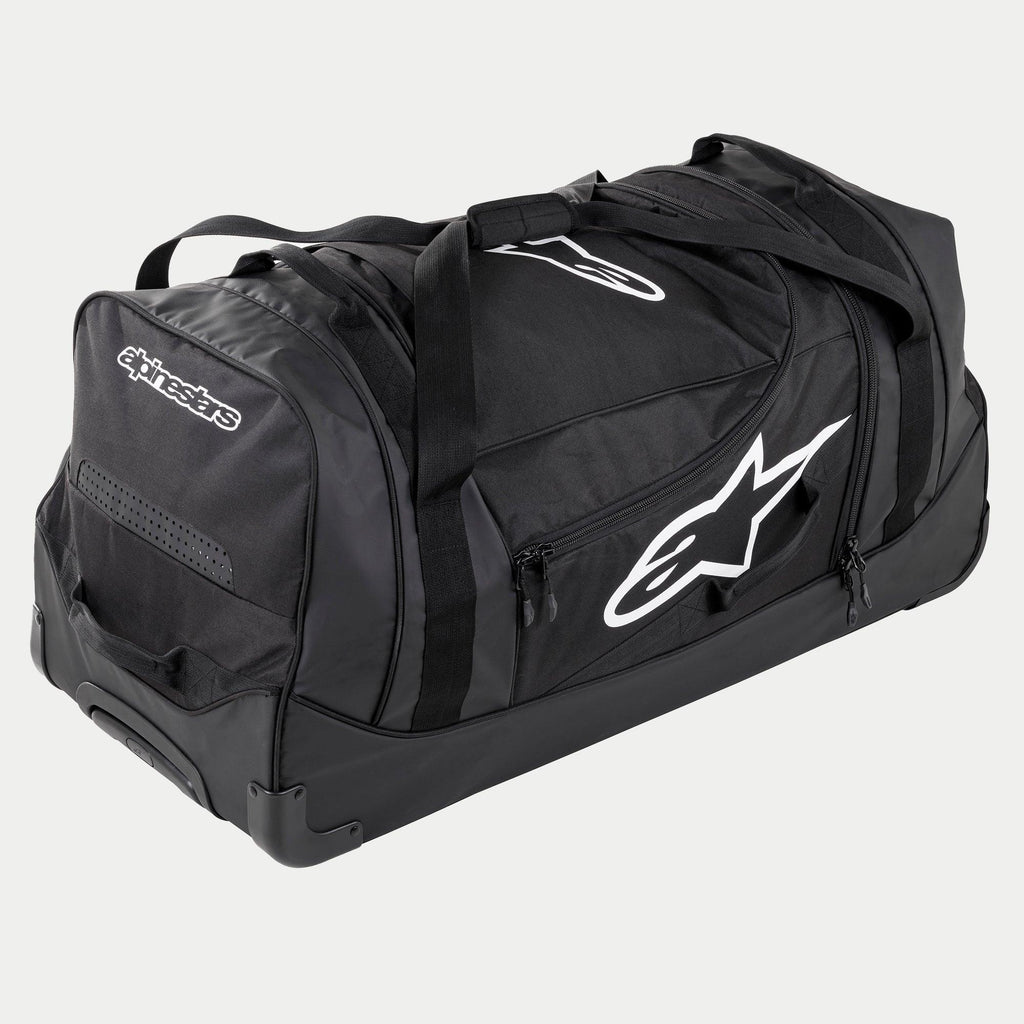 Alpinestars Komodo rejsetaske, stor taske til motocross-udstyr i sort og antracit med hvide logoer, udstyret med hjul og et teleskopisk håndtag, holdbar konstruktion til transport af racerudstyr