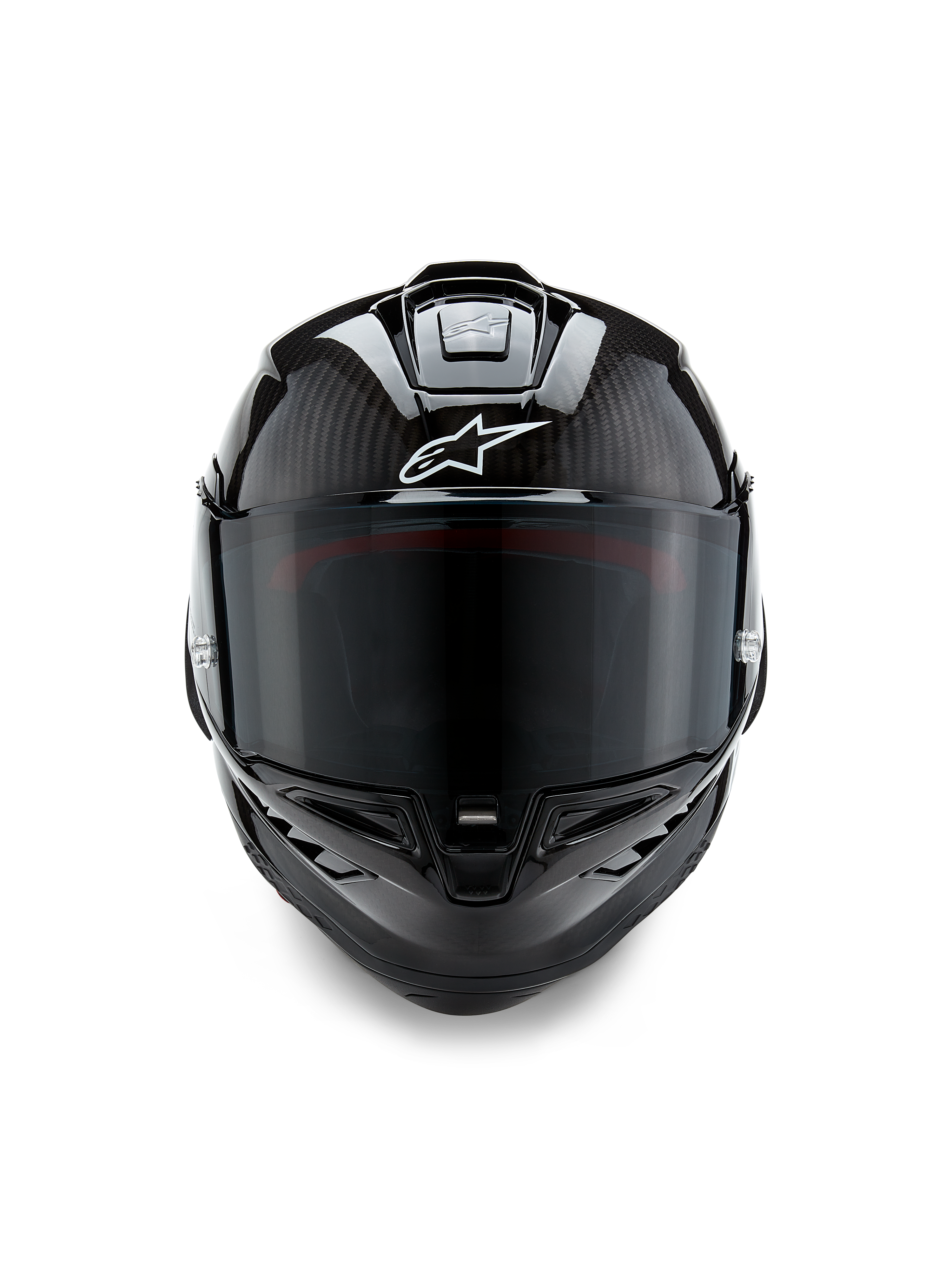 Alpinestars Supertech R10 Solid hjelm, set forfra, sort kulfiber i mat og blank finish, synlig kulfibervævning, hvidt Alpinestars-logo, mørkt røgfarvet visir, aerodynamisk racing-motorcykelhjelm