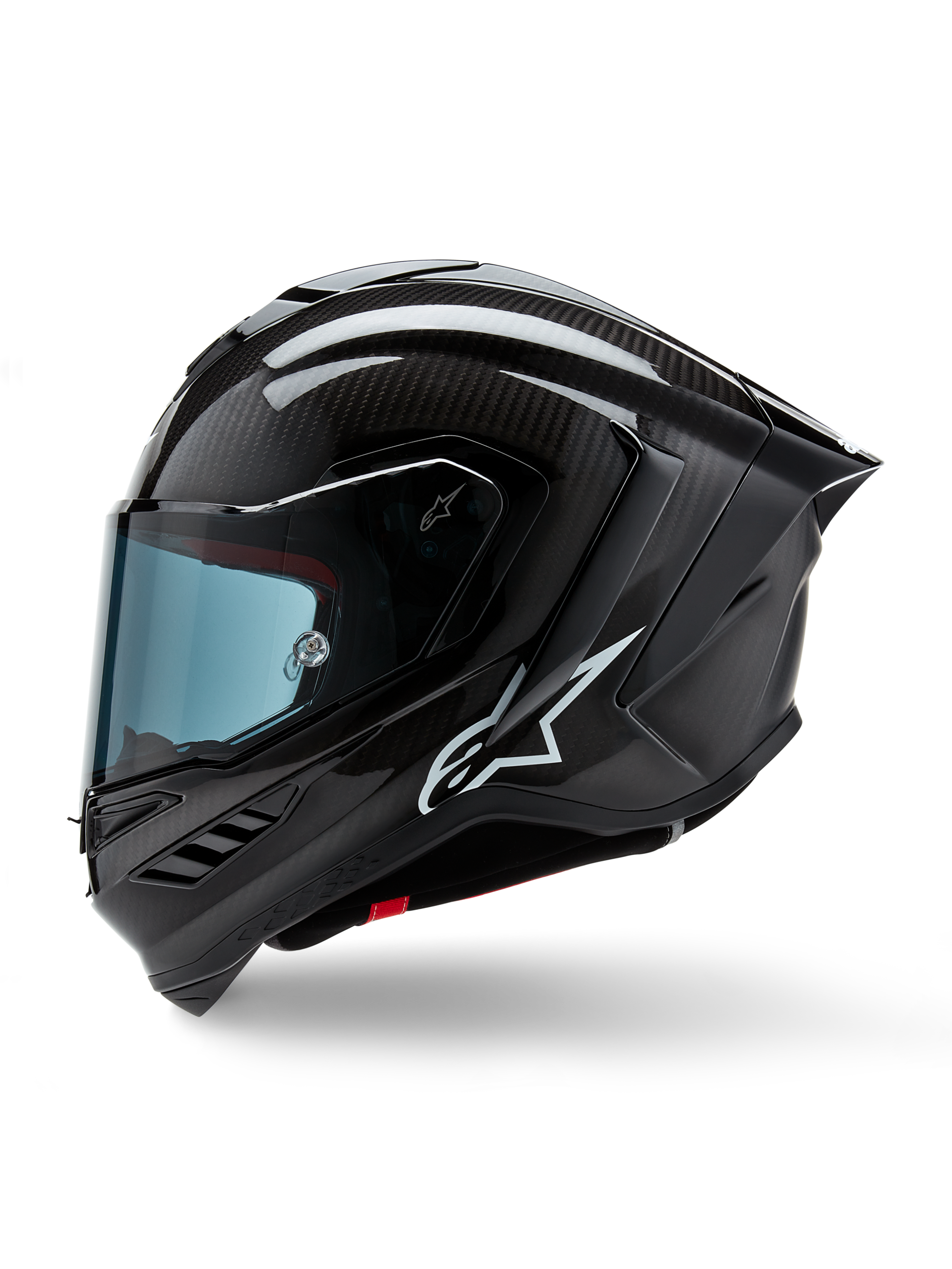 Alpinestars Supertech R10 Solid hjelm, full-face motorcykel-racerhjelm, sort karbon mat og blank, synligt kulfibervævsmønster, hvidt Alpinestars-logo på siden, aerodynamisk design med integreret hækspoiler og ventilationsåbninger, sideprofil