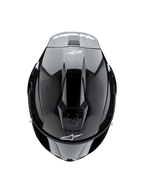Alpinestars Supertech R10 Solid hjelm, set oppefra, sort kulfiber mat og blank, viser kulfibertekstur på siderne, blank midtersektion, aerodynamiske ventiler og hvidt Alpinestars-logo foran og bagpå