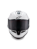 Alpinestars Supertech R10 Solid-hjelm, full-face racerhjelm, blank hvid med sorte detaljer, set forfra med mørkt tonet visir, aerodynamisk ventilationssystem og sort Astars-logo
