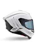Alpinestars Supertech R10 Solid hjelm, hvid blank og sort mat motorcykelracerhjelm, profilvisning fra siden, aerodynamisk design med winglets bagpå og sideventilation, blåtonet visir, med sort Alpinestars stjernelogo på siden