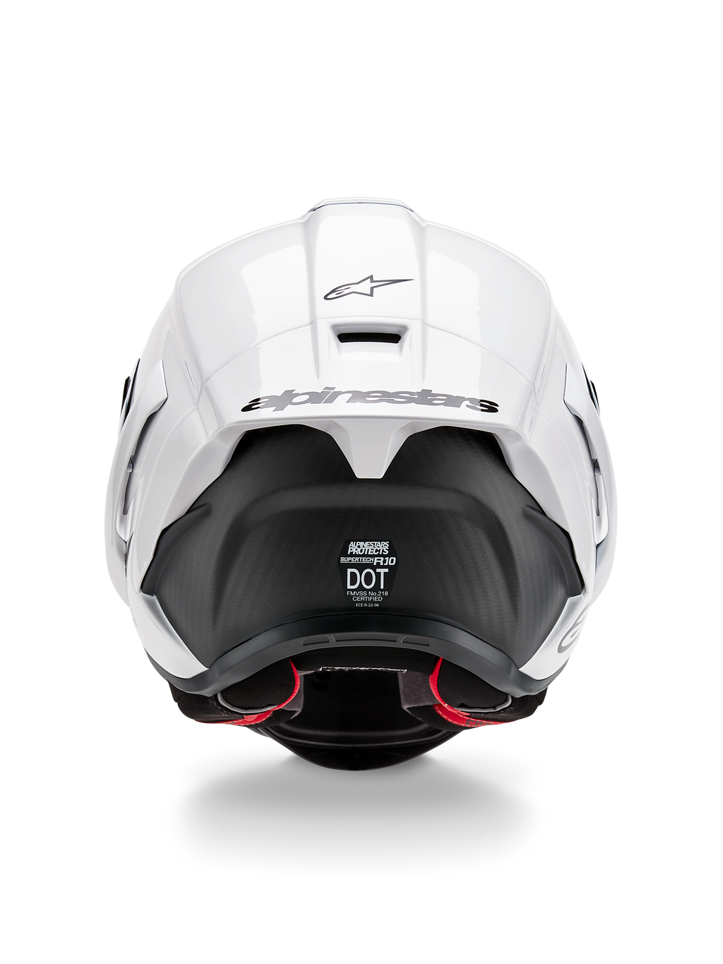 Alpinestars Supertech R10 Solid hjelm, set bagfra, hvid blank top med mat sort nedre del, aerodynamisk spoiler med sort Alpinestars-logo, synlig kulfiberstruktur og sikkerhedscertificeringsmærkater