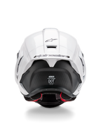 Alpinestars Supertech R10 Solid hjelm, set bagfra, hvid blank top med mat sort nedre del, aerodynamisk spoiler med sort Alpinestars-logo, synlig kulfiberstruktur og sikkerhedscertificeringsmærkater