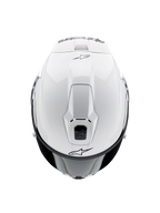 Alpinestars Supertech R10 Solid hjelm, fullface motorcykelhjelm, blank hvid, set oppefra med fokus på aerodynamiske ventiler og sorte Alpinestars-logoer, strømlinet racing-inspireret profil