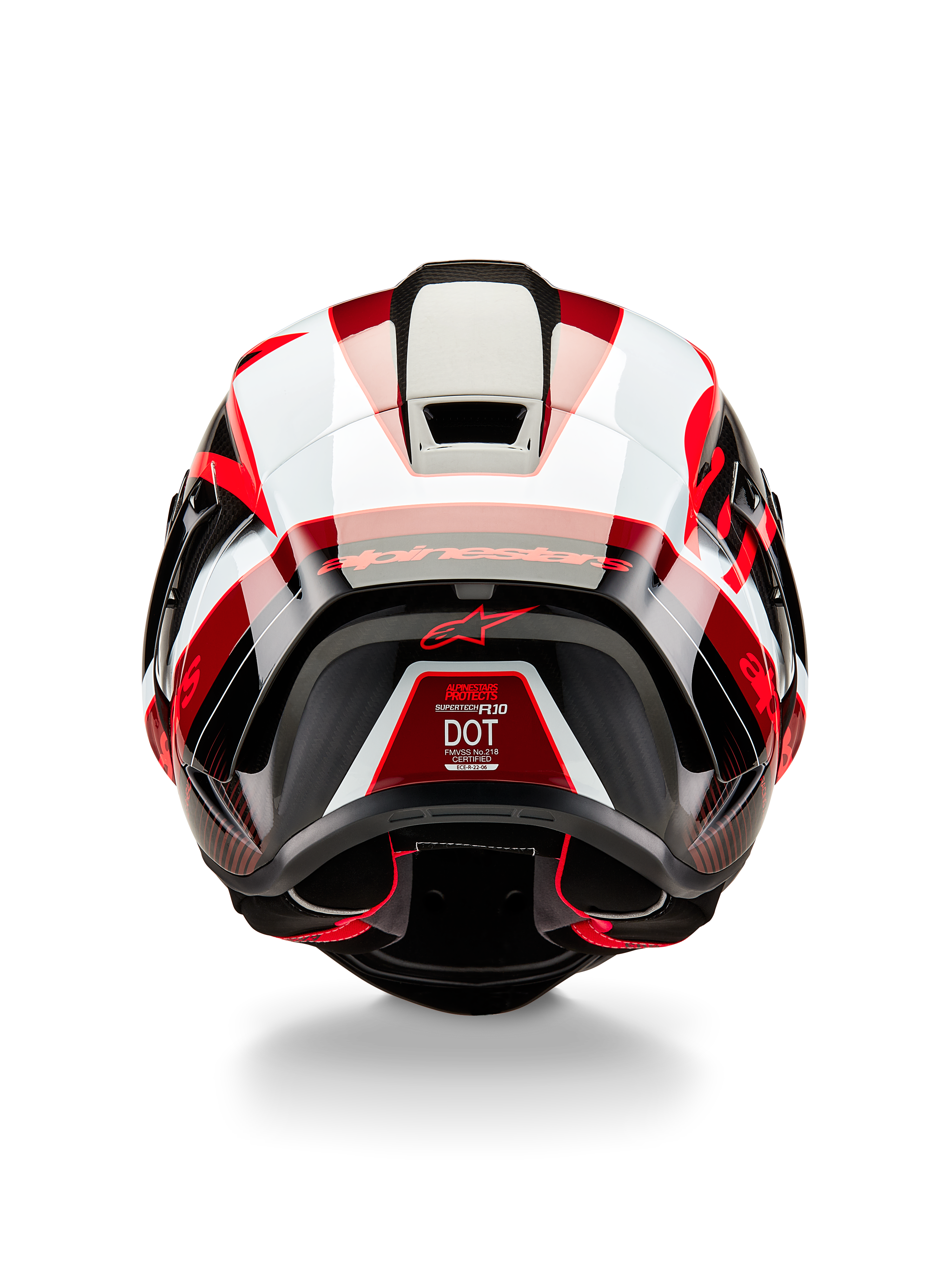 Alpinestars Supertech R10 Team hjelm, set bagfra, blank sort karbon, rød og hvid, aerodynamisk skaldesign med markante røde og hvide paneler, med Alpinestars-branding på spoileren og et rødt stjernelogo, professionel motorcykelhjelm til racing