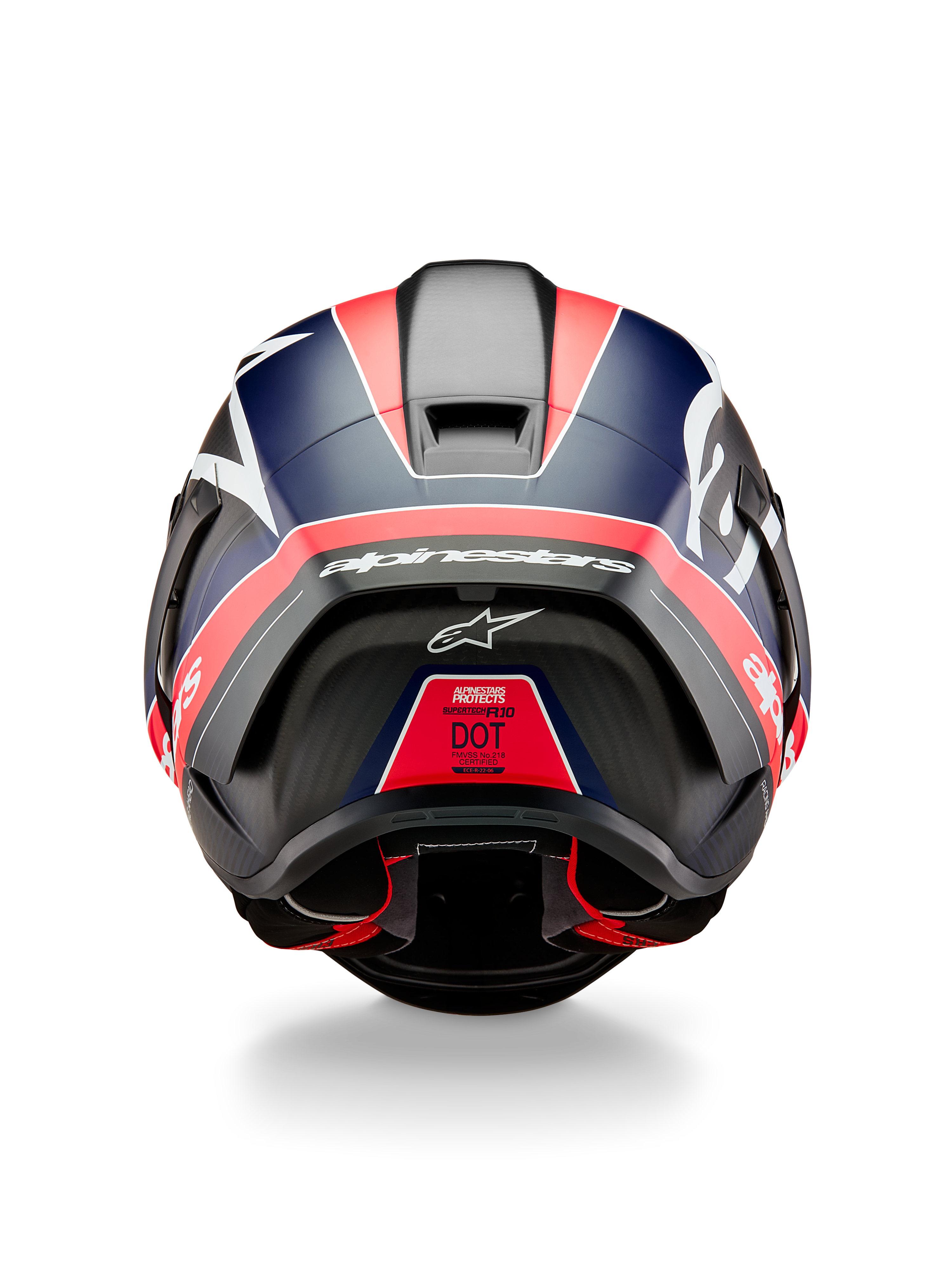 Alpinestars Supertech R10 Team-hjelm, set bagfra, sort kulfiber med fluorescerende røde og matblå detaljer, med aerodynamisk spoiler, tydeligt hvidt Alpinestars-branding og DOT-certificeringsmærke, professionelt motorsportudstyr