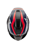 Alpinestars Supertech R10 Team hjelm, set fra oven, sort karbon med rød fluo og mat blå grafik, aerodynamisk skaldesign med øverste ventilationsåbninger og markante racerdetaljer