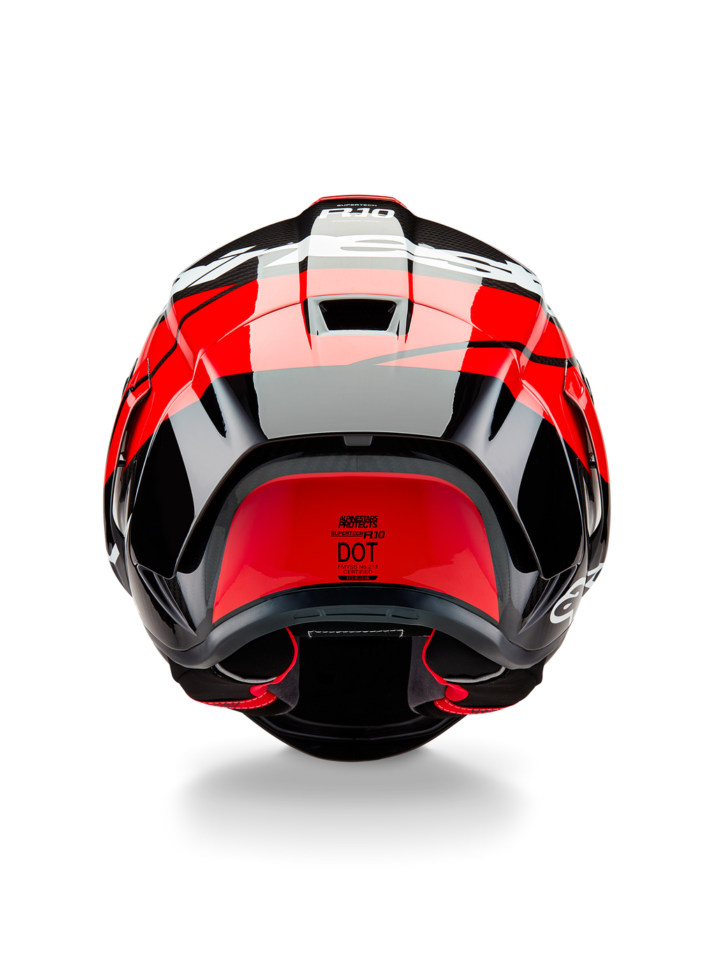 Alpinestars Supertech R10 Element-hjelm, set bagfra, sort kulfiber med klare røde og hvide blanke detaljer, med en aerodynamisk bagspoiler, udluftningsventiler og DOT-certificeringsmærkat, strømlinet racerinspireret design med kulfiberdetaljer