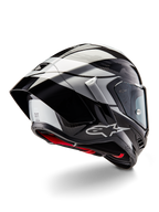 Alpinestars Supertech R10 Element-hjelm, Black Carbon Silver Black Glossy, trekvart visning bagfra som viser den aerodynamiske racerprofil, blank kulfiberskal med geometrisk grå og sort grafik, Alpinestars-logo og rød indvendig polstring