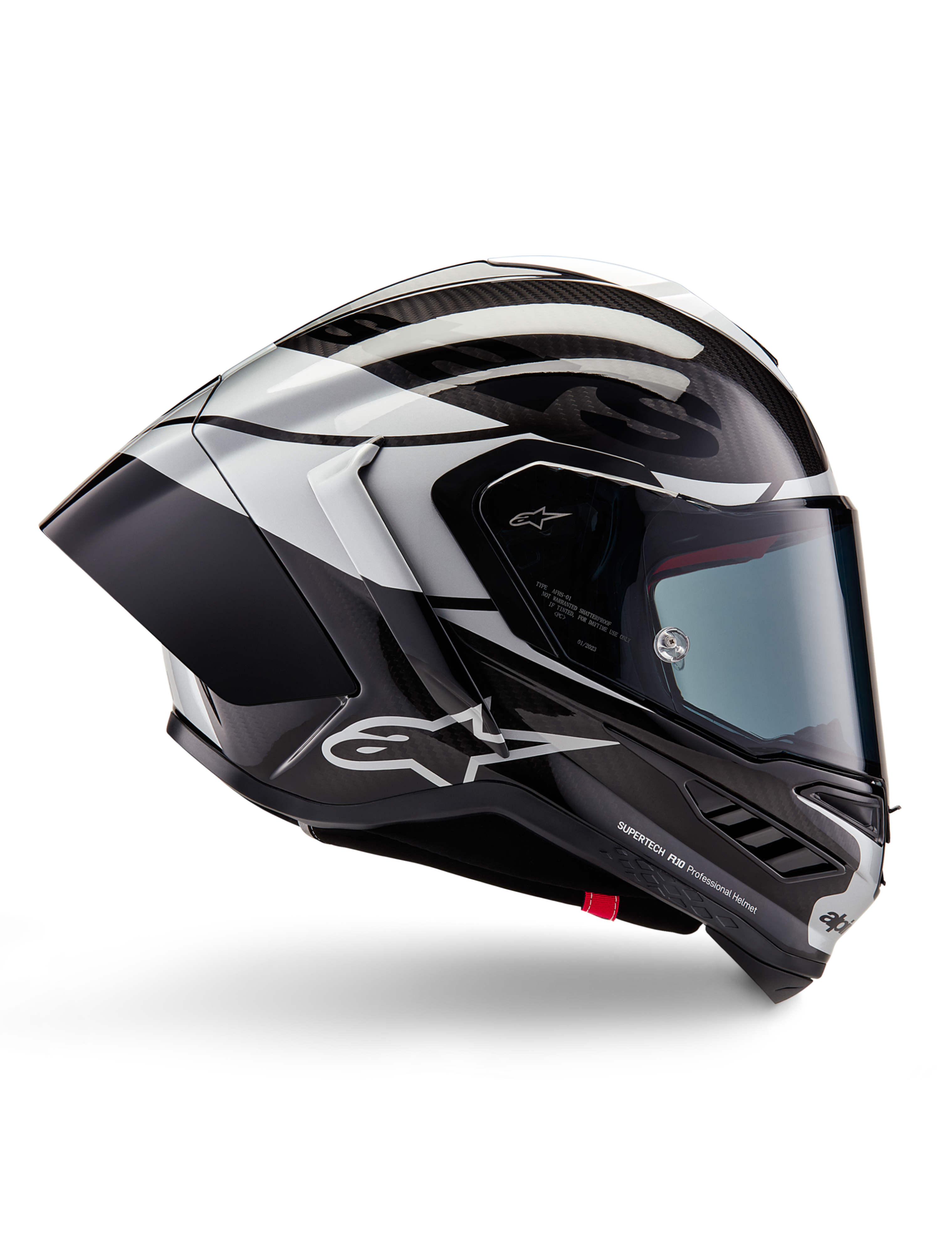 Alpinestars Supertech R10 Element-hjelm, full-face motorcykelracerhjelm, sort carbon, sølv og blank sort finish, sideprofil med aerodynamisk kulfiberskal, klart visir og markant Alpinestars-branding.