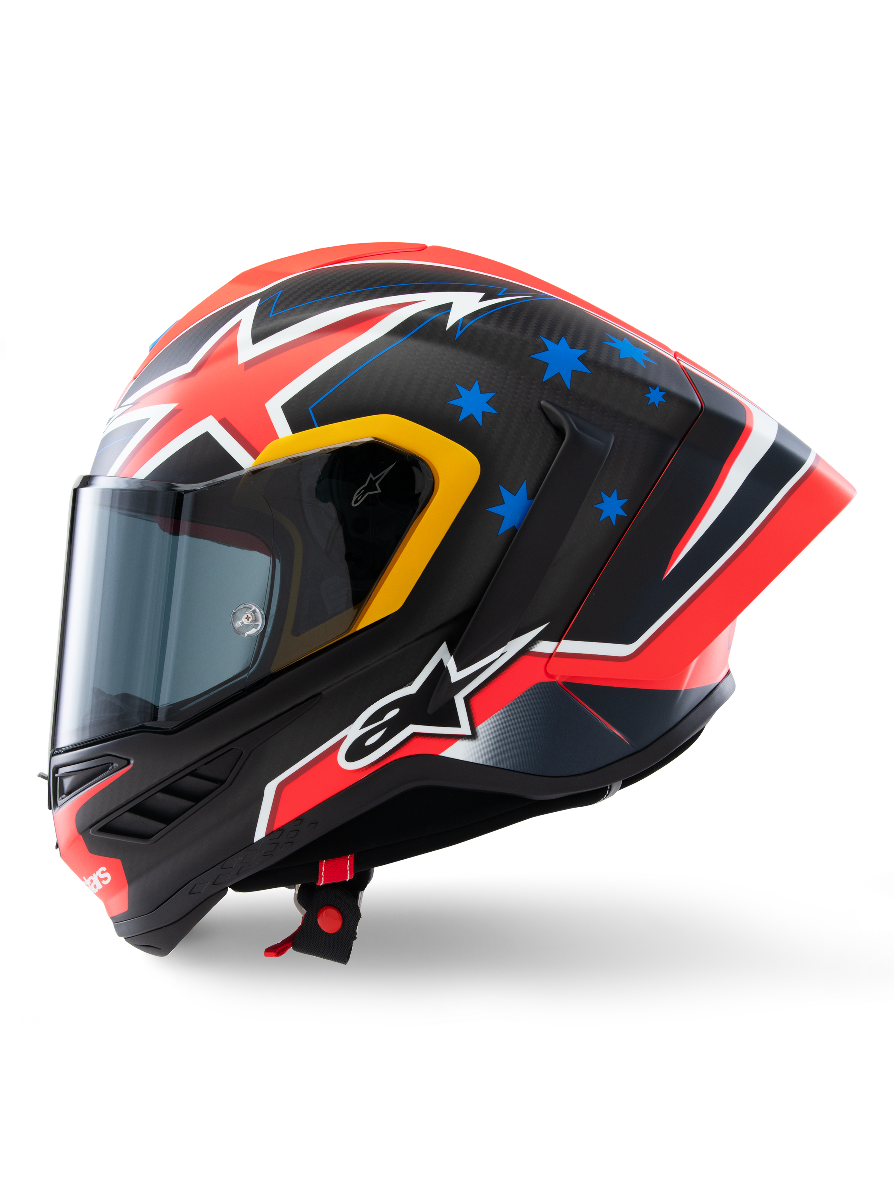Alpinestars Supertech R10 Miller Limited Edition hjelm, set fra siden, Carbon Red Matt finish med synlig kulfibervævning, rød og hvid lyn-grafik, blå stjerner bagpå, gule detaljer omkring visiret og hvidt Alpinestars-logo, højtydende racerhjelm til motorcykel