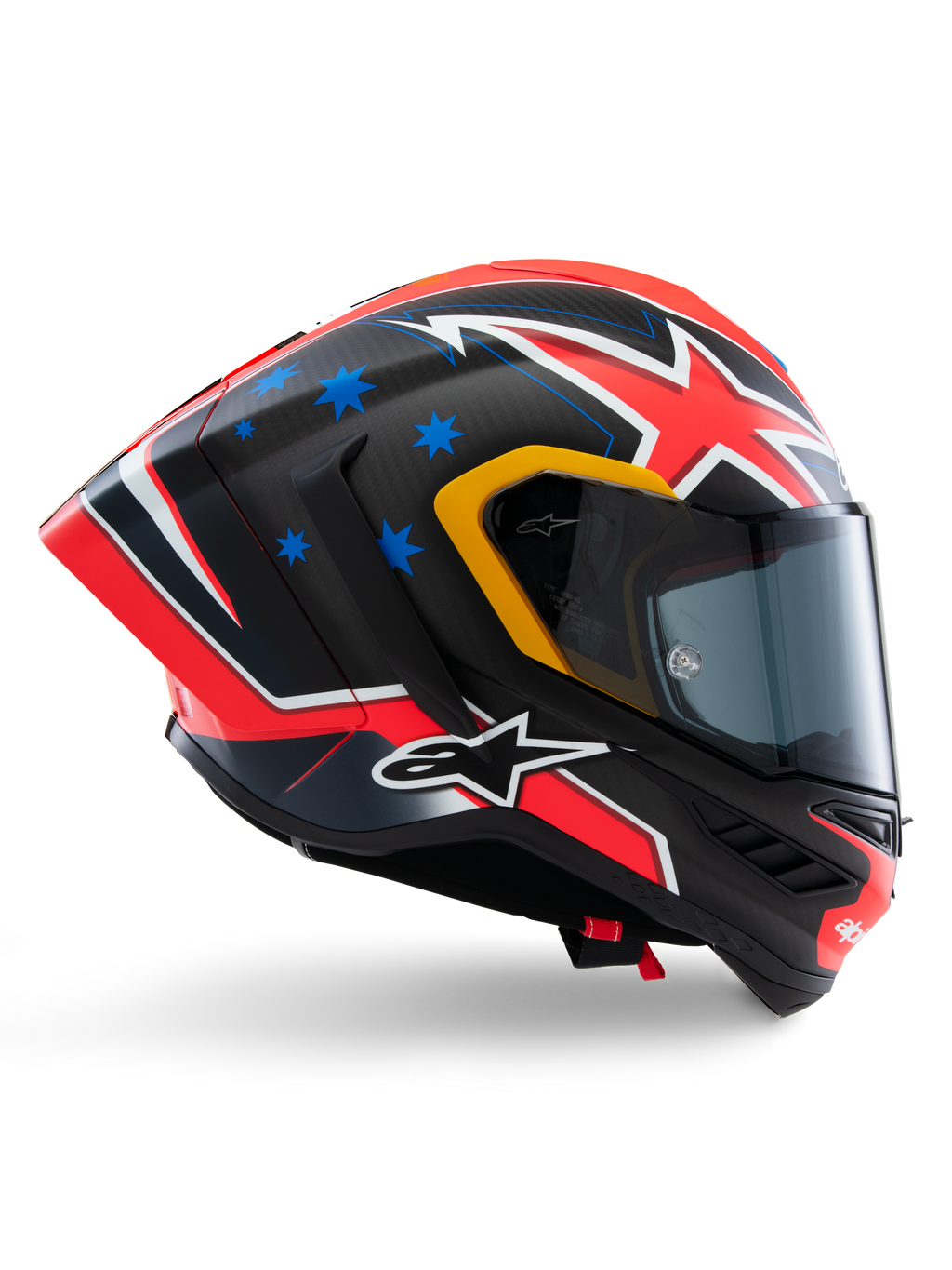 Alpinestars Supertech R10 Miller Limited Edition hjelm, full-face racerhjelm, mat carbon med rød, hvid og blå grafik, blå stjerne-detaljer og gul kant ved visir, aerodynamisk profil med mørkt røgfarvet visir, højtydende sikkerhedsudstyr til motorcykel