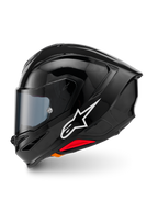 Alpinestars S-R7 Solid hjelm, helhjelm til motorcykel, blank sort, profilvisning fra venstre side med hvidt Alpinestars-logo, aerodynamisk skal med integreret spoiler, tonet visir og røde nødudløsningsdetaljer.
