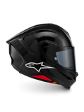 Alpinestars S-R7 Solid hjelm, full-face motorcykelhjelm, blank sort, profilvisning med et hvidt A-star-logo, strømlinet aerodynamisk skal med integreret spoiler og røde detaljer ved bunden, designet til racing og sportspræstationer.